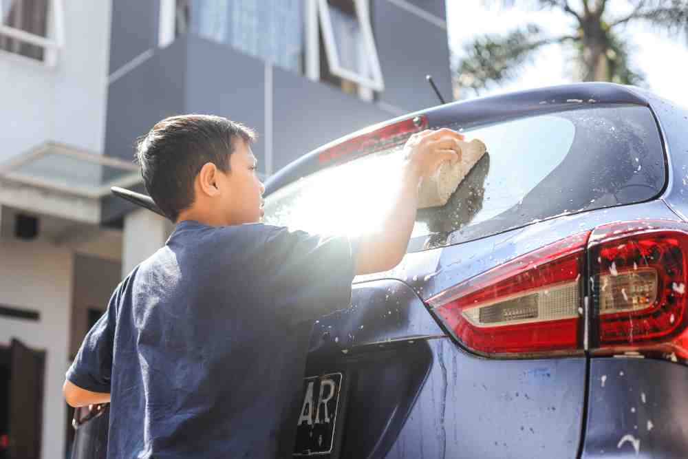 boy washing a car 2021 09 04 10 33 46 utc 1