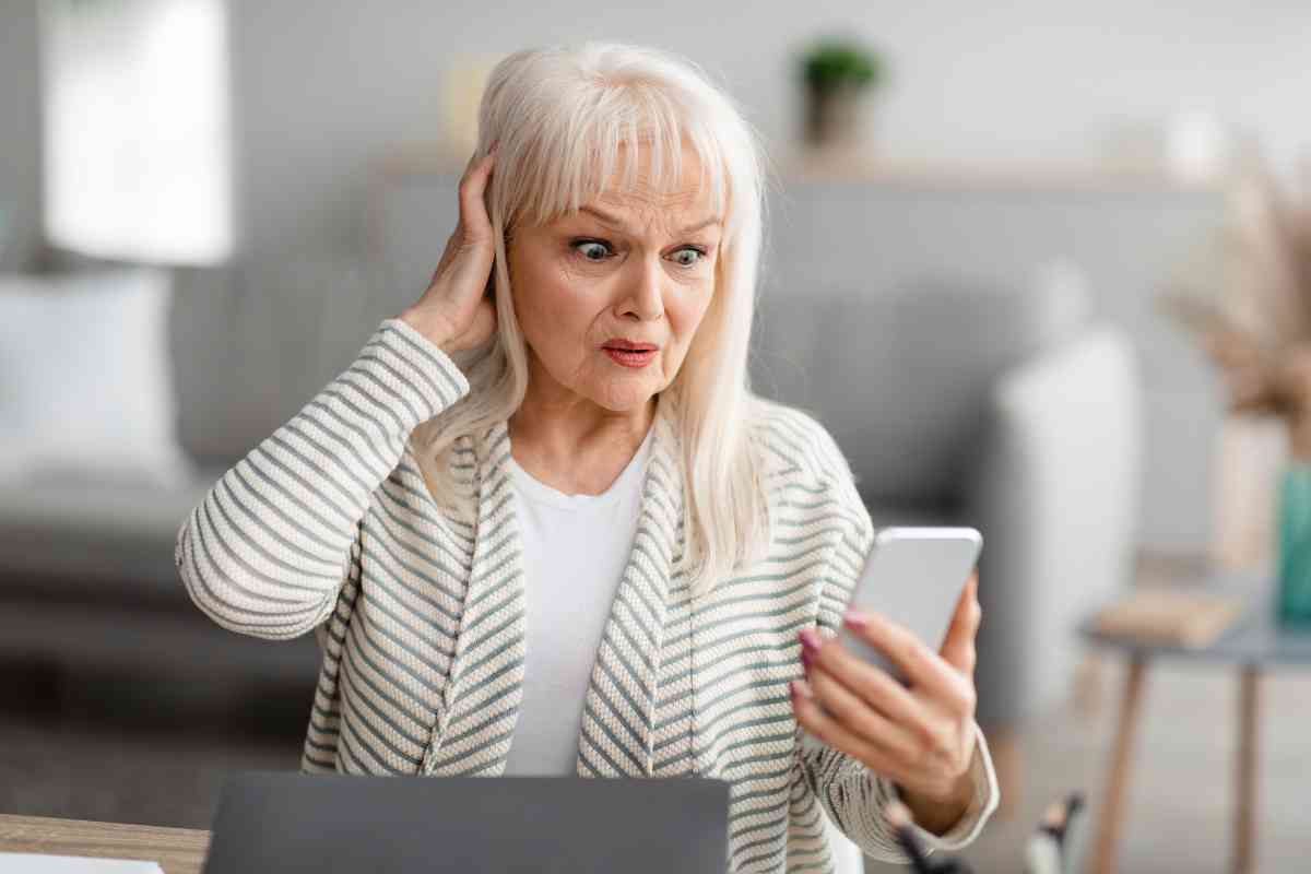 shocked senior woman using her mobile phone 2021 09 03 16 19 07 utc 1