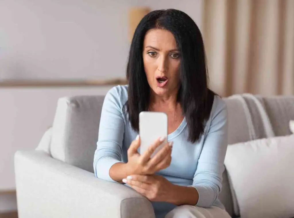 surprised shocked mature woman using mobile phone 2022 02 05 11 56 31 utc 1