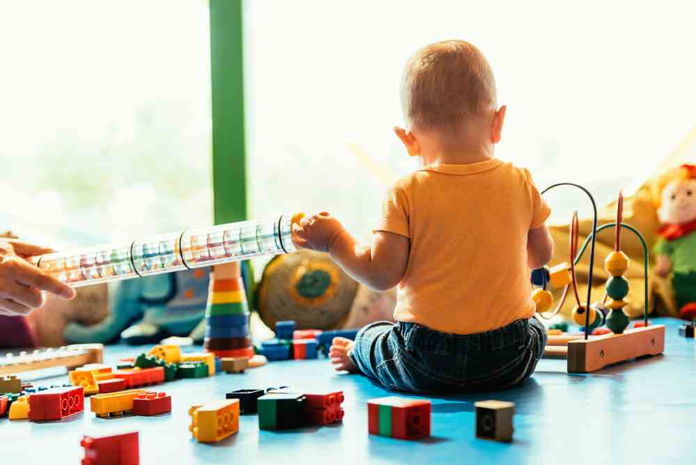happy baby playing with toy blocks 2021 08 28 03 09 58 utc 1